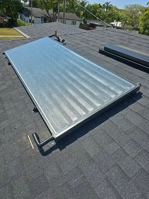 Solar water heating collector mounted on a Florida tile roof